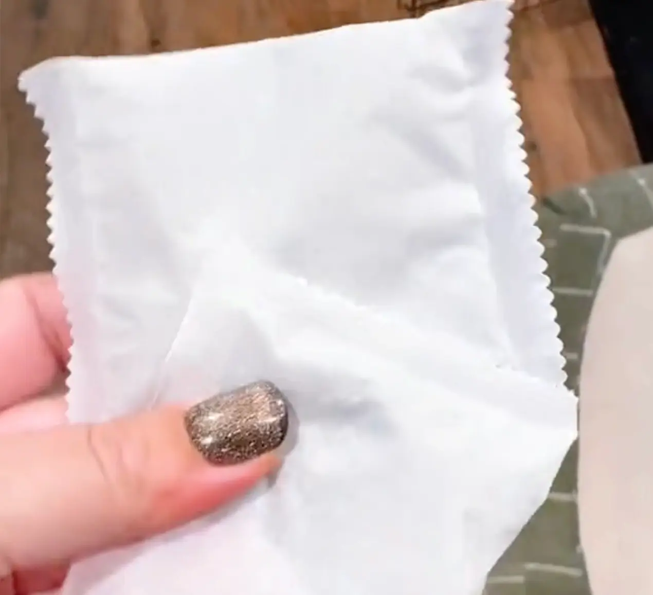 Holding a Pest Vault scent pouch